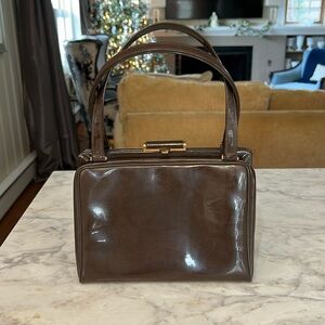 Vintage Bonwit teller patent leather cocoa brown purse with gold hardware.